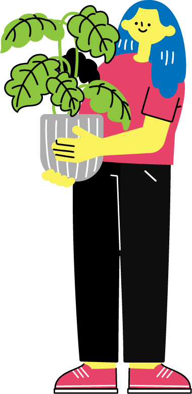 観葉植物を抱える女性