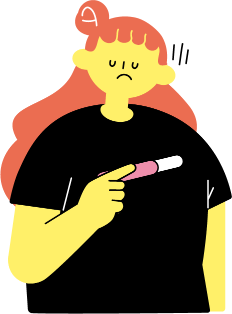 妊娠検査薬を見て落ち込む女性