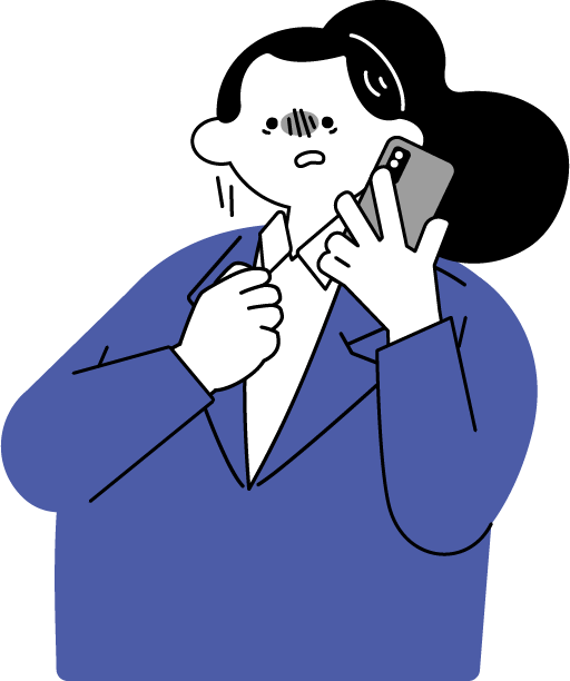 電話でクレームを受けて萎縮する女性