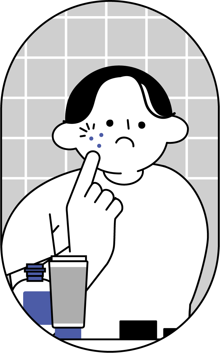 鏡でニキビに気づく男性