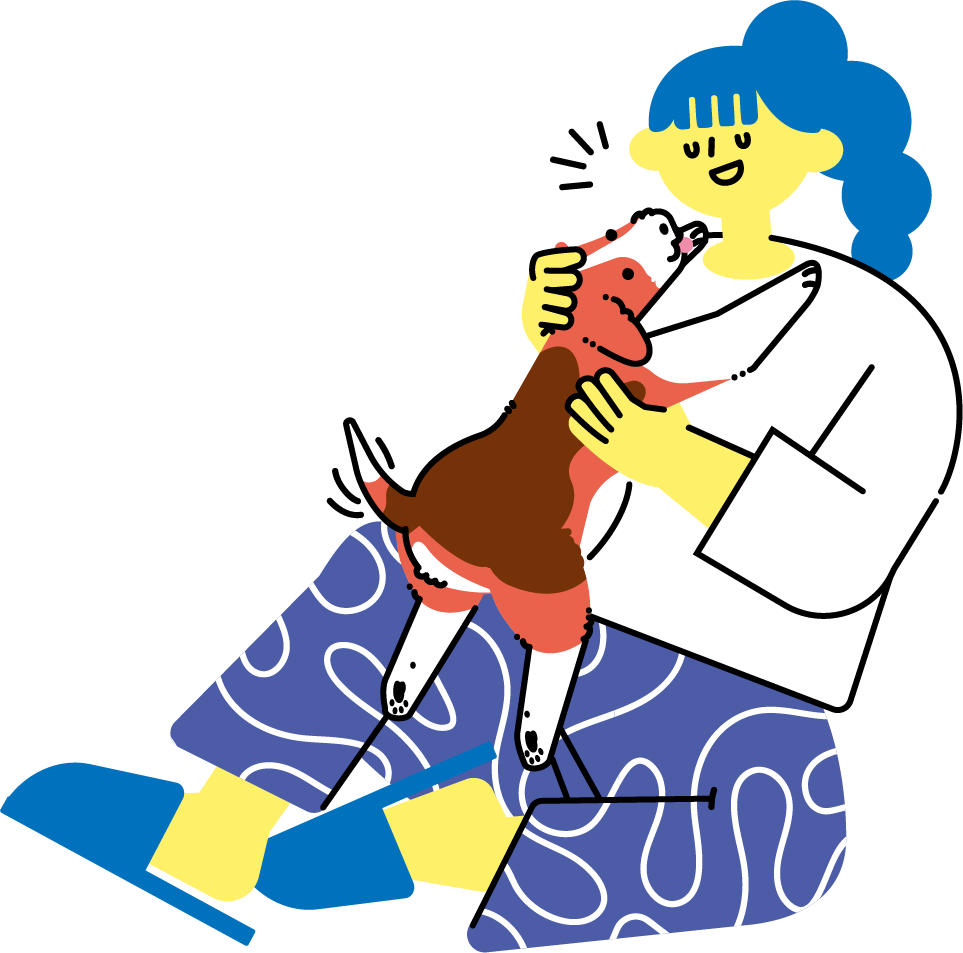 犬を抱っこしてふれあう女性